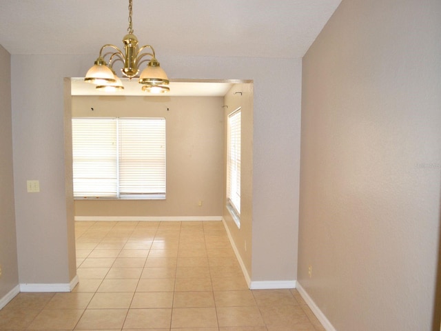 254 Marion Oaks Mnr, Ocala, FL 34473 - empty room with a chandelier and light tile patterned floors