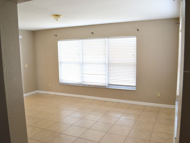 254 Marion Oaks Mnr, Ocala, FL 34473 - unfurnished room with baseboards and light tile patterned floors