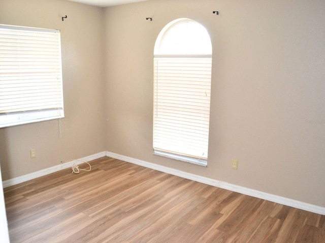 254 Marion Oaks Mnr, Ocala, FL 34473 - spare room with light wood-type flooring and baseboards