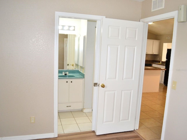 254 Marion Oaks Mnr, Ocala, FL 34473 - corridor with a sink and light tile patterned flooring