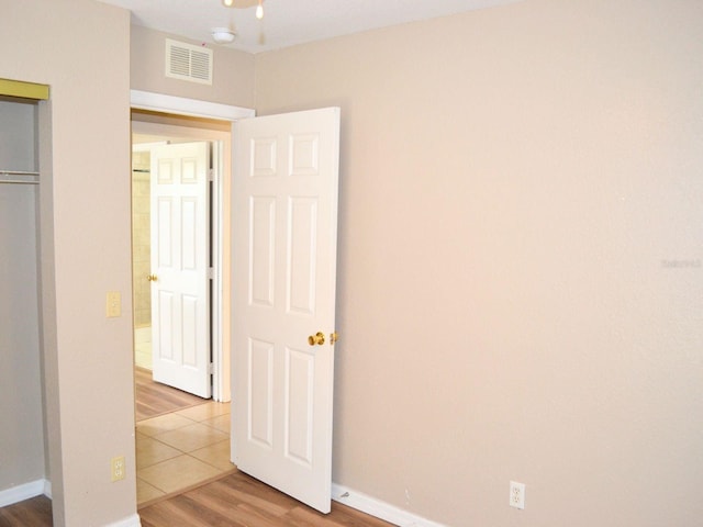 254 Marion Oaks Mnr, Ocala, FL 34473 - unfurnished bedroom featuring light wood finished floors and a closet