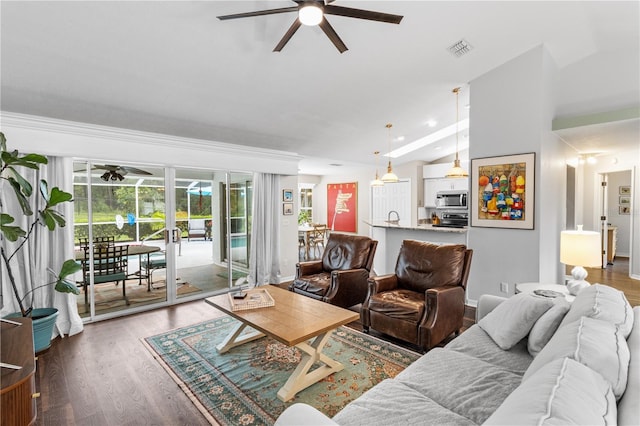 1882 E Monopoly Loop, Inverness, FL 34453 - living area with a ceiling fan and wood finished floors