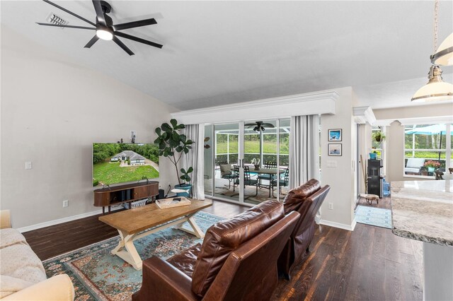 1882 E Monopoly Loop, Inverness, FL 34453 - living area featuring ceiling fan, dark wood-style flooring, healthy amount of natural light, and vaulted ceiling