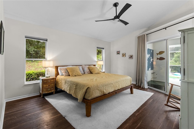 1882 E Monopoly Loop, Inverness, FL 34453 - bedroom with vaulted ceiling, access to exterior, multiple windows, dark wood-type flooring, and ceiling fan