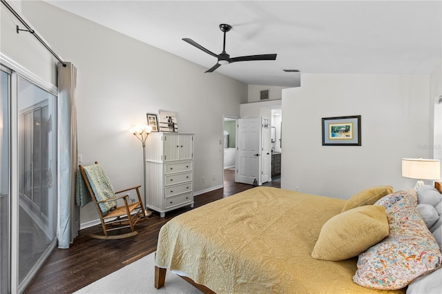 1882 E Monopoly Loop, Inverness, FL 34453 - bedroom featuring dark wood-style floors, vaulted ceiling, and ensuite bathroom