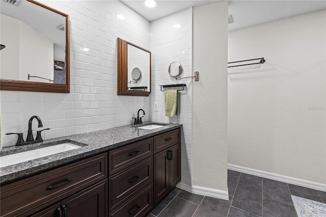 1882 E Monopoly Loop, Inverness, FL 34453 - bathroom with double vanity, backsplash, and tile patterned floors