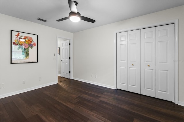 1882 E Monopoly Loop, Inverness, FL 34453 - unfurnished bedroom with dark wood-style flooring, a closet, and a ceiling fan