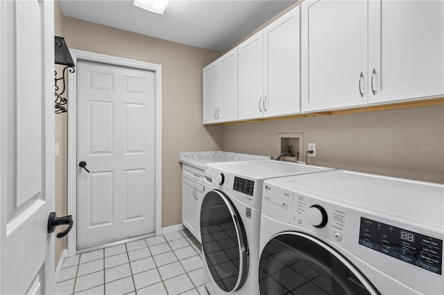 1882 E Monopoly Loop, Inverness, FL 34453 - washroom featuring washing machine and dryer, cabinet space, and light tile patterned floors