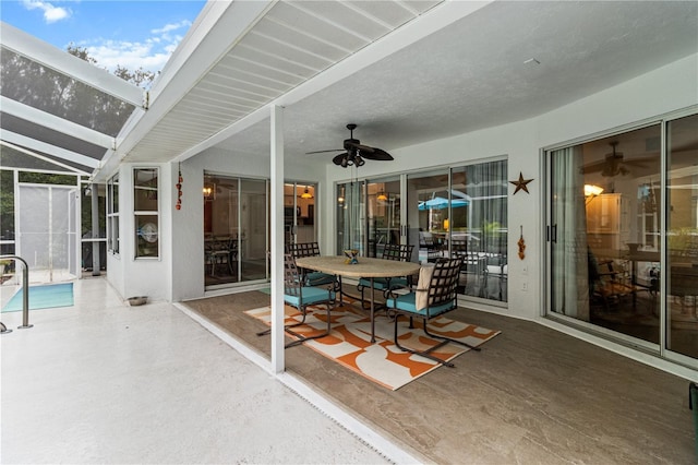 1882 E Monopoly Loop, Inverness, FL 34453 - view of patio / terrace with ceiling fan, a lanai, and an outdoor pool