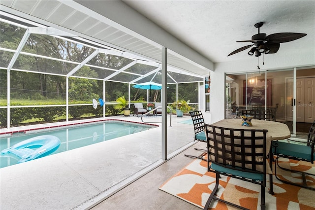 1882 E Monopoly Loop, Inverness, FL 34453 - swimming pool featuring a patio, ceiling fan, and glass enclosure