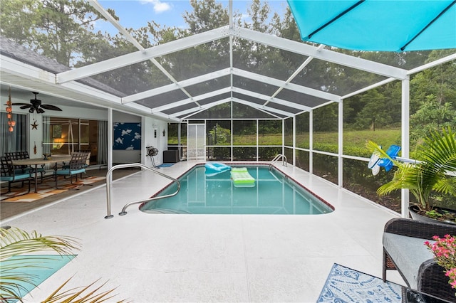 1882 E Monopoly Loop, Inverness, FL 34453 - swimming pool featuring a patio area, ceiling fan, and glass enclosure