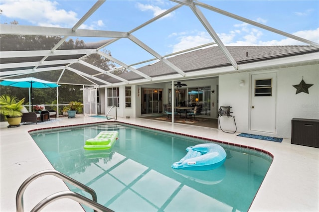 1882 E Monopoly Loop, Inverness, FL 34453 - outdoor pool featuring a patio, a ceiling fan, and glass enclosure