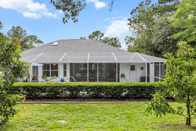 1882 E Monopoly Loop, Inverness, FL 34453 - rear view of property featuring a lawn, a lanai, and a shingled roof