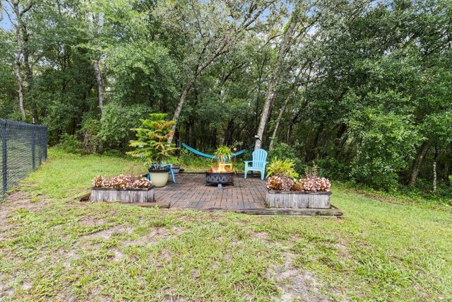 1882 E Monopoly Loop, Inverness, FL 34453 - view of yard featuring an outdoor fire pit