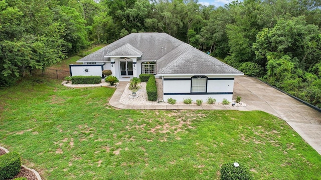 1882 E Monopoly Loop, Inverness, FL 34453 - view of front facade with stucco siding and roof with shingles