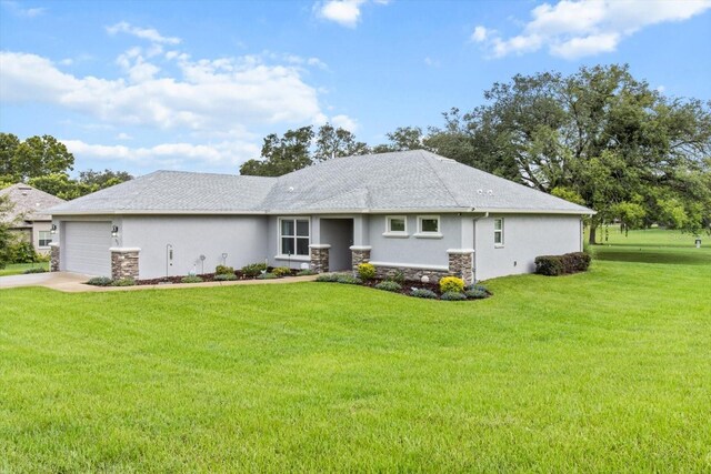 837 E Epsom Ct, Hernando, FL 34442 - view of front of home with stucco siding, stone siding, a garage, a front yard, and driveway