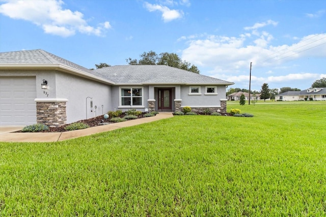 837 E Epsom Ct, Hernando, FL 34442 - view of front facade featuring stone siding, stucco siding, a front lawn, and a garage