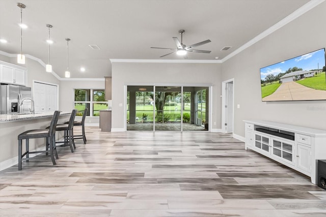 837 E Epsom Ct, Hernando, FL 34442 - living room with ornamental molding, ceiling fan, recessed lighting, and light wood-style flooring