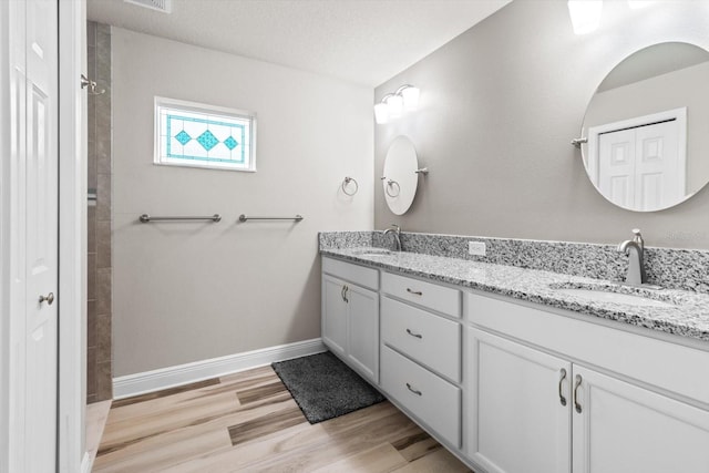 837 E Epsom Ct, Hernando, FL 34442 - full bath with double vanity, wood finished floors, and a tile shower