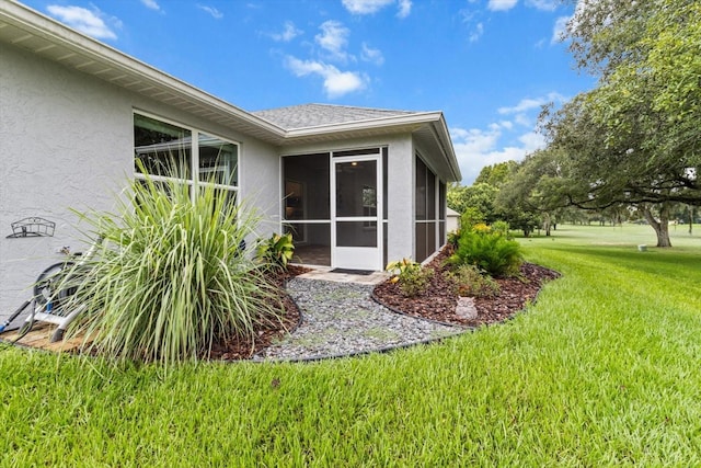 837 E Epsom Ct, Hernando, FL 34442 - view of side of property featuring stucco siding, a sunroom, and a yard
