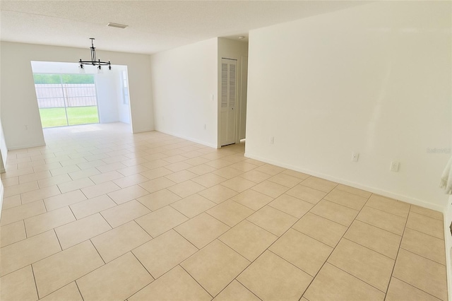 15091 SW 35th Cir, Ocala, FL 34473 - unfurnished room featuring a chandelier and light tile patterned floors