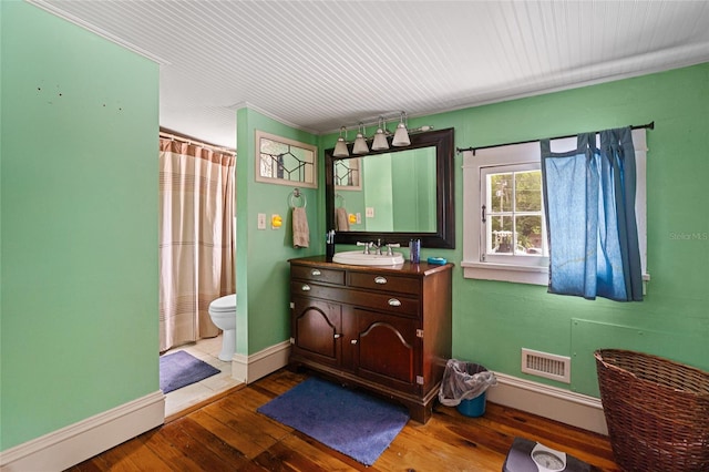 11 62nd St, Yankeetown, FL 34498 - full bath with vanity, wood finished floors, and curtained shower