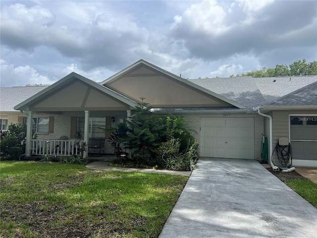 8552 SW 92nd Ln Unit C, Ocala, FL 34481 - ranch-style house with brick siding, an attached garage, a porch, driveway, and roof with shingles