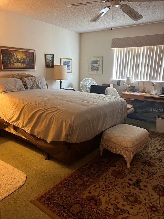 8552 SW 92nd Ln Unit C, Ocala, FL 34481 - carpeted bedroom featuring a textured ceiling and ceiling fan