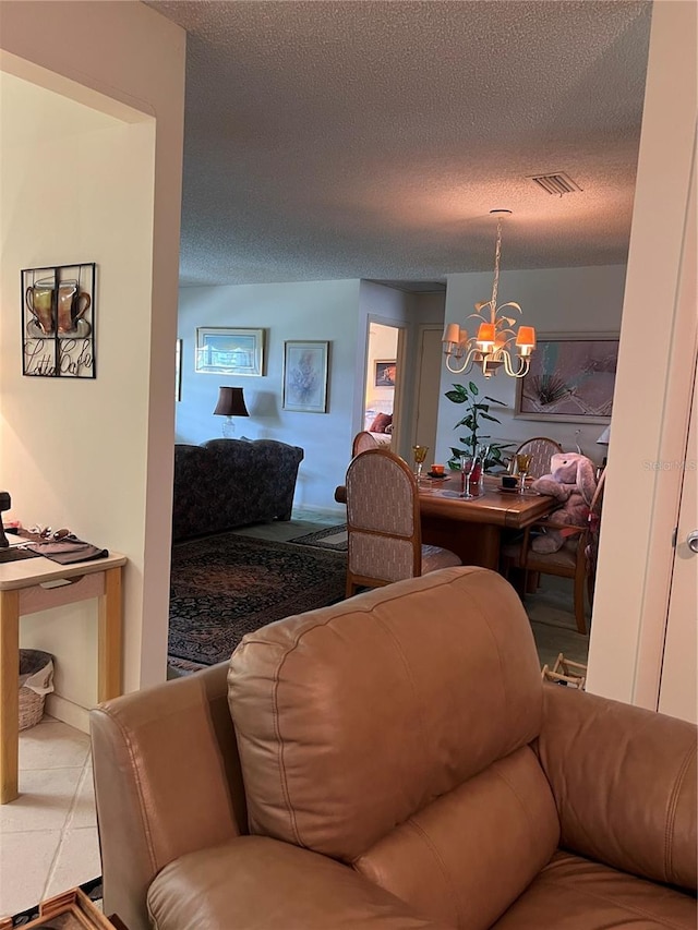 8552 SW 92nd Ln Unit C, Ocala, FL 34481 - living area with a chandelier and a textured ceiling
