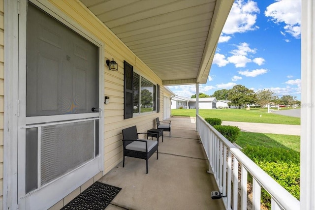 10492 SE 178th St, Summerfield, FL 34491 - covered porch featuring a lawn