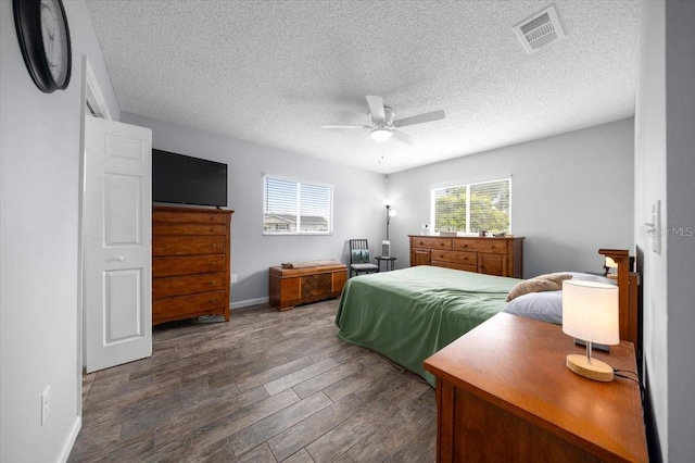 10492 SE 178th St, Summerfield, FL 34491 - bedroom featuring wood finished floors, a textured ceiling, and a ceiling fan