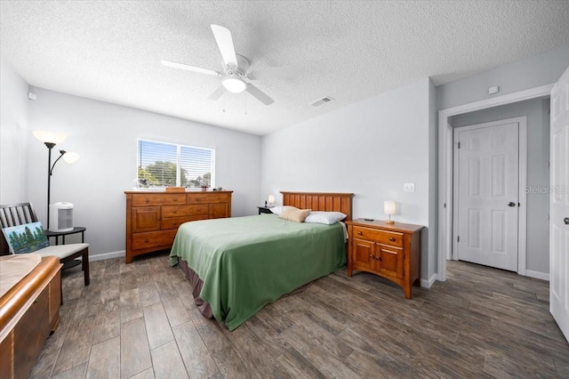 10492 SE 178th St, Summerfield, FL 34491 - bedroom featuring dark wood finished floors, a textured ceiling, and a ceiling fan