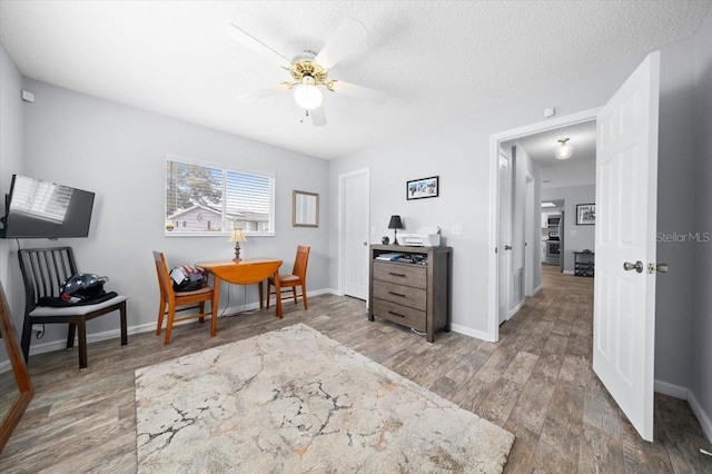 10492 SE 178th St, Summerfield, FL 34491 - home office featuring wood finished floors, ceiling fan, and a textured ceiling