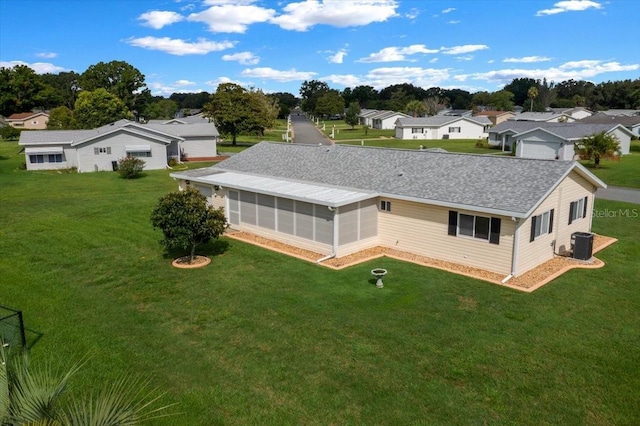 10492 SE 178th St, Summerfield, FL 34491 - rear view of property with a sunroom, a residential view, and a lawn