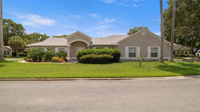 705 Guava Dr, Saint Augustine, FL 32095 - ranch-style home featuring a front yard and stucco siding