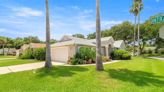 705 Guava Dr, Saint Augustine, FL 32095 - view of front of home featuring a garage, driveway, a front yard, and stucco siding