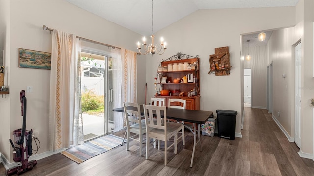 705 Guava Dr, Saint Augustine, FL 32095 - dining room with wood finished floors, a chandelier, and vaulted ceiling