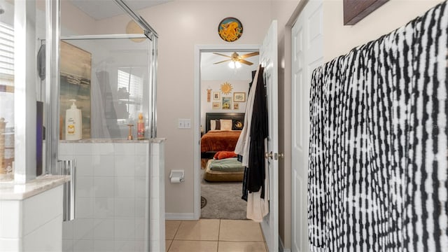 705 Guava Dr, Saint Augustine, FL 32095 - ensuite bathroom with a shower stall, tile patterned flooring, and a ceiling fan