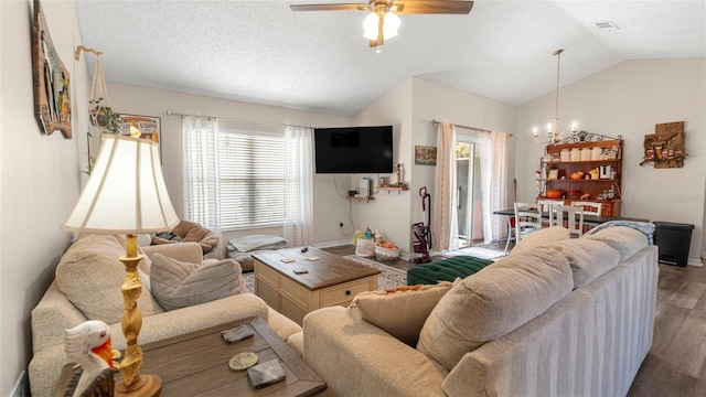 705 Guava Dr, Saint Augustine, FL 32095 - living room featuring lofted ceiling, a chandelier, wood finished floors, a textured ceiling, and ceiling fan
