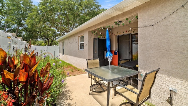 705 Guava Dr, Saint Augustine, FL 32095 - fenced backyard featuring a patio area and outdoor dining space