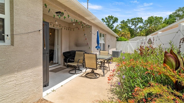 705 Guava Dr, Saint Augustine, FL 32095 - fenced backyard with a patio and outdoor dining area