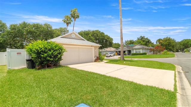 705 Guava Dr, Saint Augustine, FL 32095 - view of front of property featuring concrete driveway, a front lawn, and stucco siding