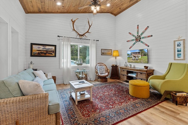 5328 Riverside Dr, Yankeetown, FL 34498 - living room with wooden ceiling, wood finished floors, high vaulted ceiling, a ceiling fan, and wood walls