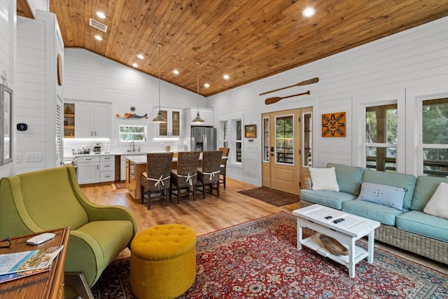 5328 Riverside Dr, Yankeetown, FL 34498 - living room with wooden ceiling, light wood-style floors, high vaulted ceiling, and recessed lighting