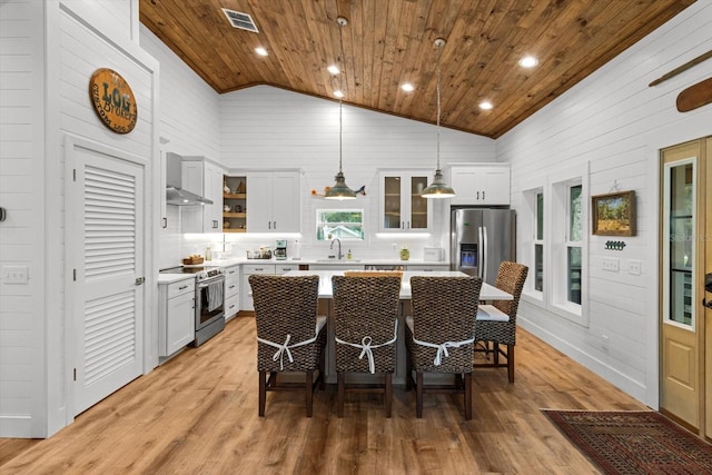 5328 Riverside Dr, Yankeetown, FL 34498 - kitchen with appliances with stainless steel finishes, wood ceiling, light countertops, open shelves, and a kitchen island