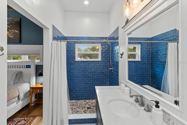 5328 Riverside Dr, Yankeetown, FL 34498 - bathroom featuring plenty of natural light, tiled shower, vanity, and ensuite bathroom