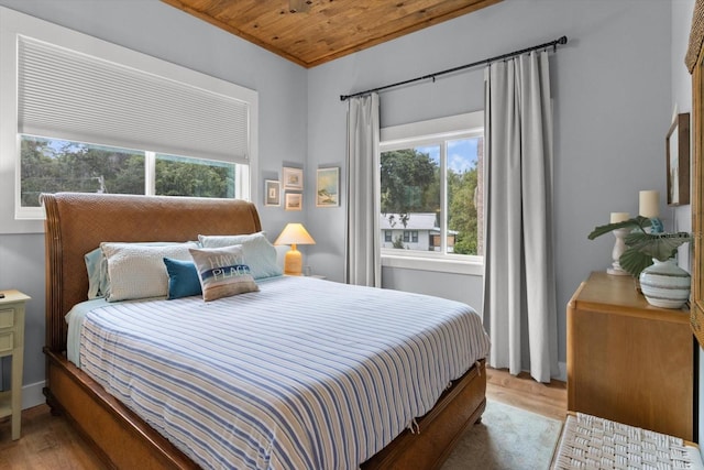 5328 Riverside Dr, Yankeetown, FL 34498 - bedroom with light wood-style floors, multiple windows, and wood ceiling