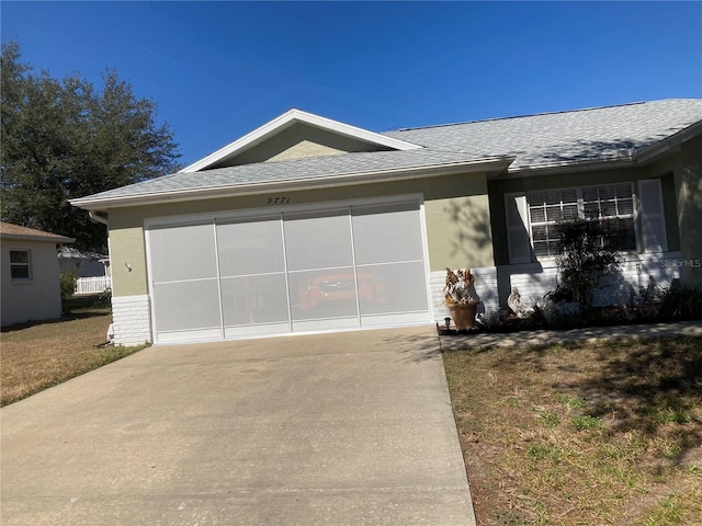 9771 SW 97th Ln, Ocala, FL 34481 - ranch-style home featuring concrete driveway, brick siding, an attached garage, and roof with shingles