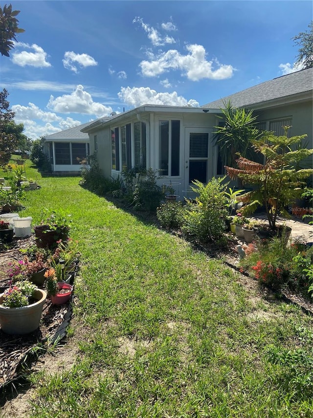 9771 SW 97th Ln, Ocala, FL 34481 - view of property exterior featuring a lawn