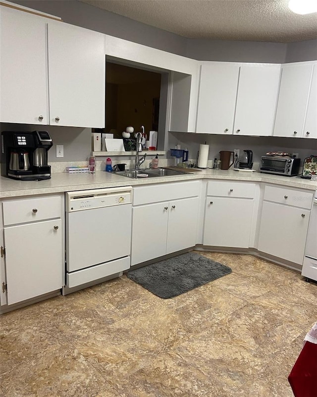 9771 SW 97th Ln, Ocala, FL 34481 - kitchen featuring white dishwasher, white cabinets, light countertops, and a textured ceiling